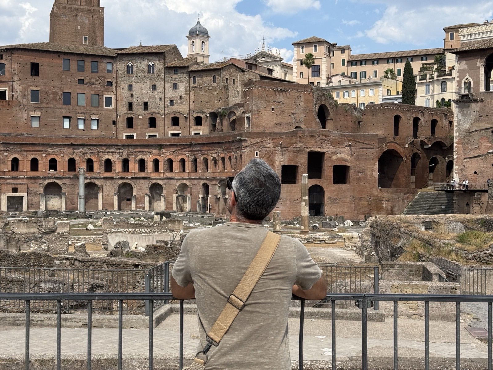Italy for seniors &mdash; an older traveller above the Markets of Trajan in Rome