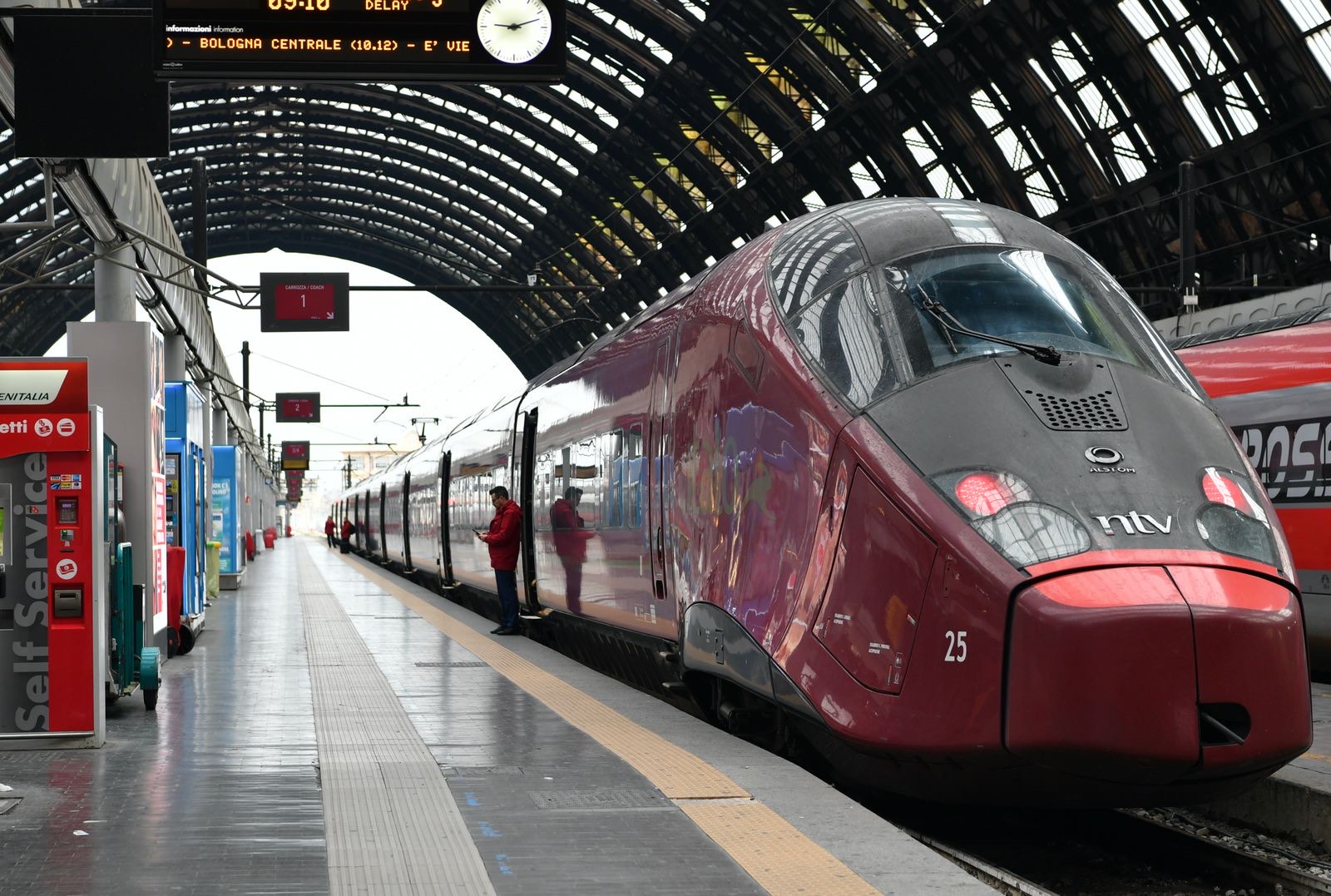 Train travel in Italy &mdash; an Italo and a Frecciarossa at Milano Centrale